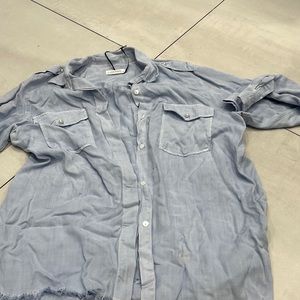 Blue button down with pearl details and ripped bottom